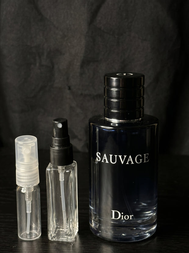 Dior Sauvage Eau de Toilette bottle with clear Velmori decant atomizer vials on dark background
